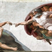 Christ touching Adam in Michelangelo's "Creation of Man."