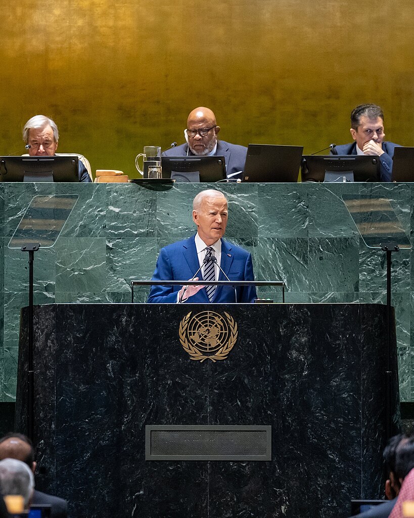 US President Joe Biden stands at the podium in the UN General Assembly Hall and addresses a crowd.