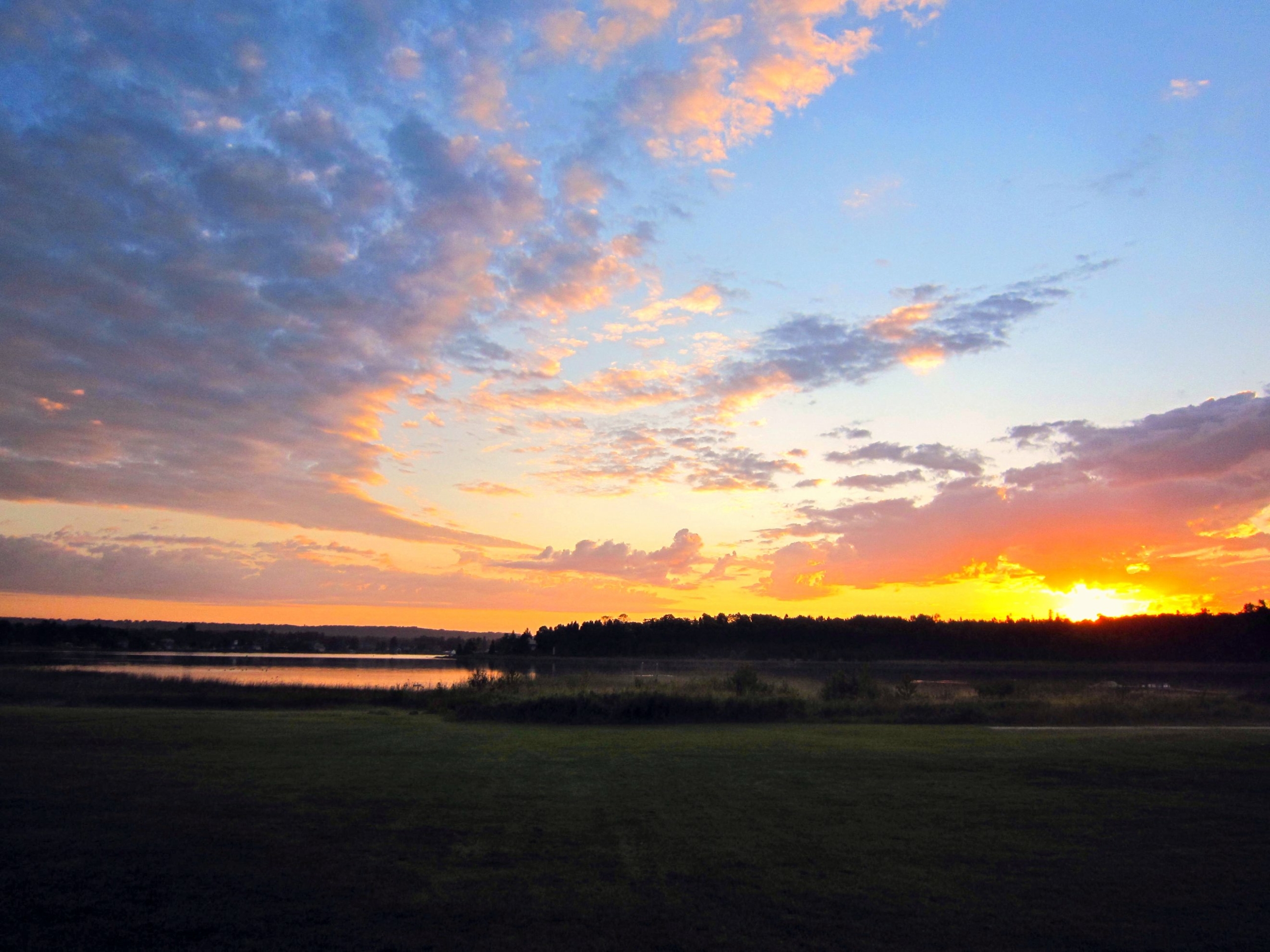 Photograph showing a sunrise of Les Cheneaux Islands