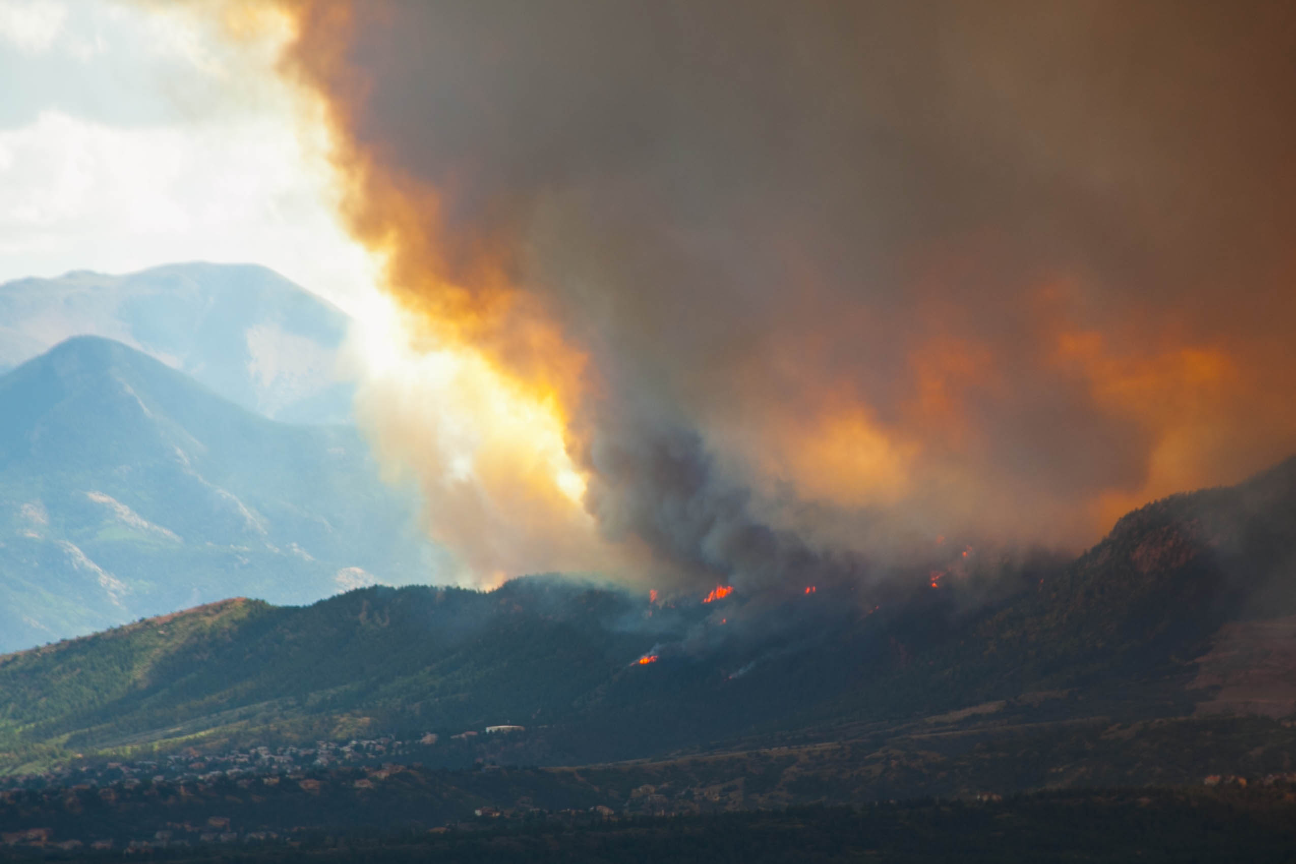 Wildfire burning on a mountain range