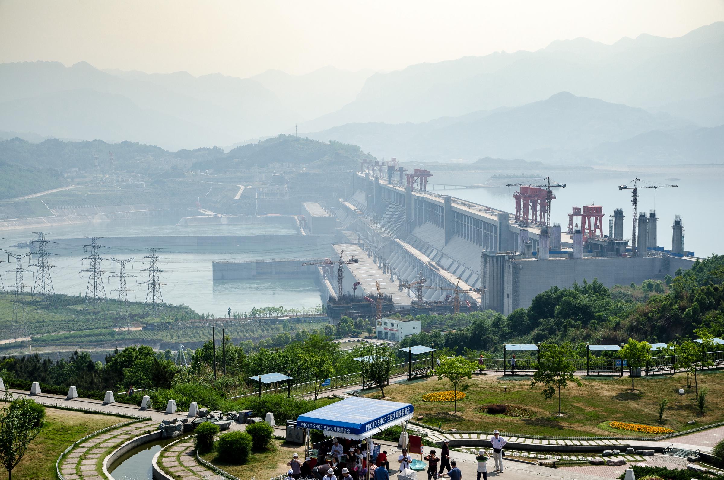 Three Gorges Dam with lookout point in foreground and mountains in background