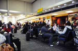 Busy JFK airport full of waiting passengers