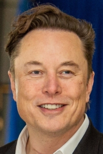 headshot of Elon Musk, smiling