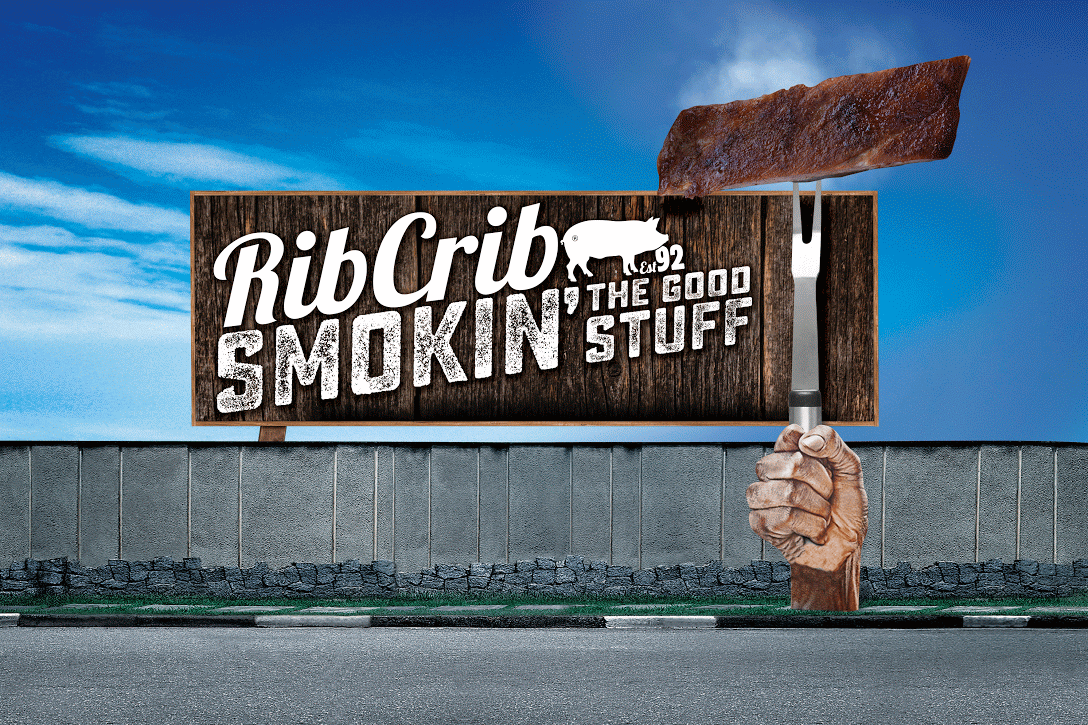 animation of a billboard ad for a rib restaurant with a giant fist holding a fork with a slab of smoking ribs on the end