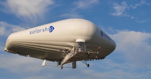picture of a wing-shaped blimp with "Solarship" printed on the side