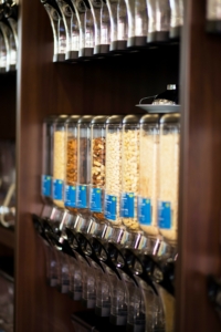 a row of dispensers of items sold in bulk