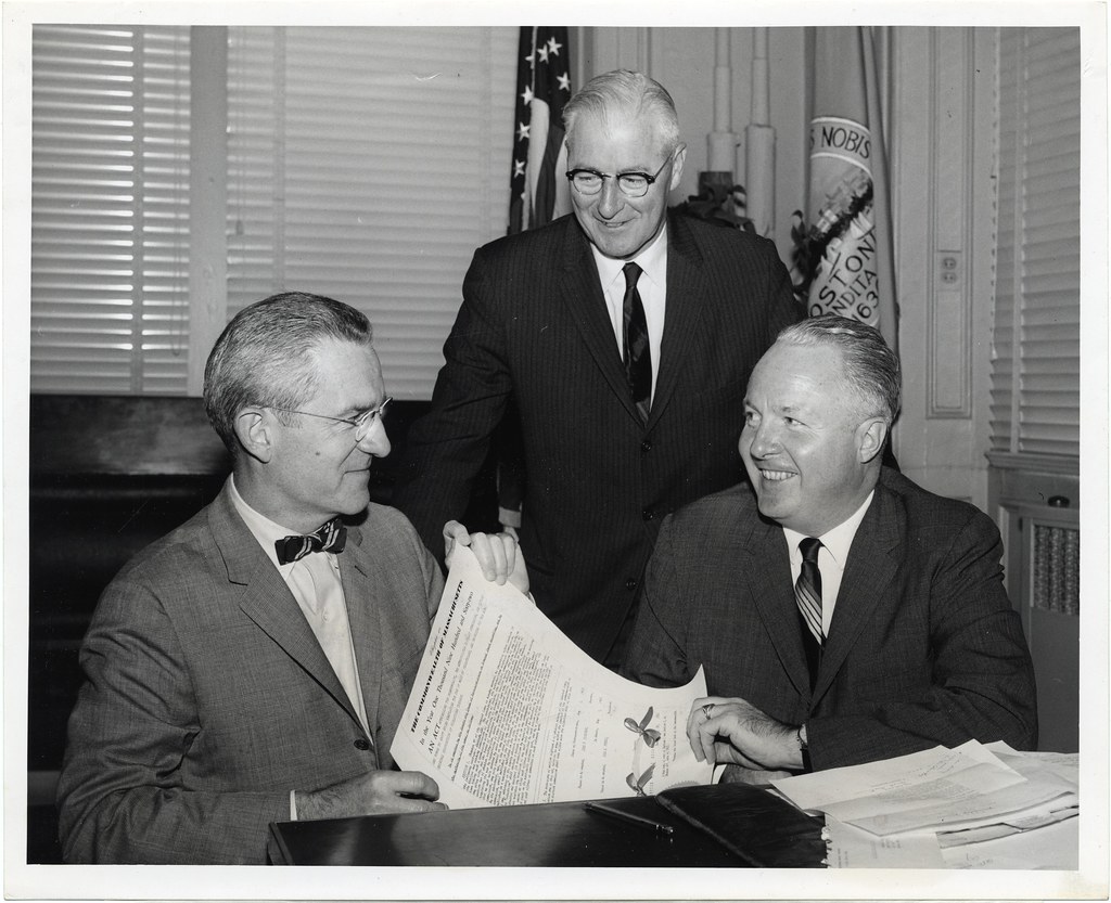 Robert S. Kretshmar, Executive Secretary of AAA's Massachusetts Division; Commissioner Thomas F. Carty, Boston Traffic Department; and Mayor John F. Collins celebrate jaywalking legislation by Boston City Archives