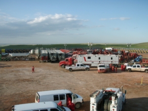trucks and other equipment for fracking near and agricultural field
