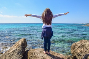 Image of girl looking out over the sea