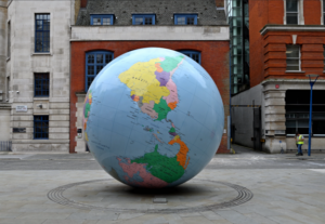 A large globe with the southern hemisphere on top, in a public square