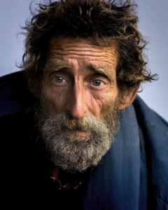 homeless man looking straight at the camera