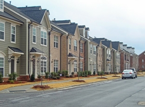 A row of newly built townhomes.