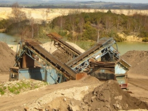 photo of sand mining near a river