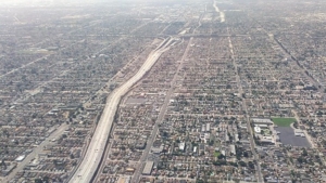 aerial view of a highway and surrounding sprawl
