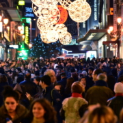 a crowd of people christmas shopping in the city